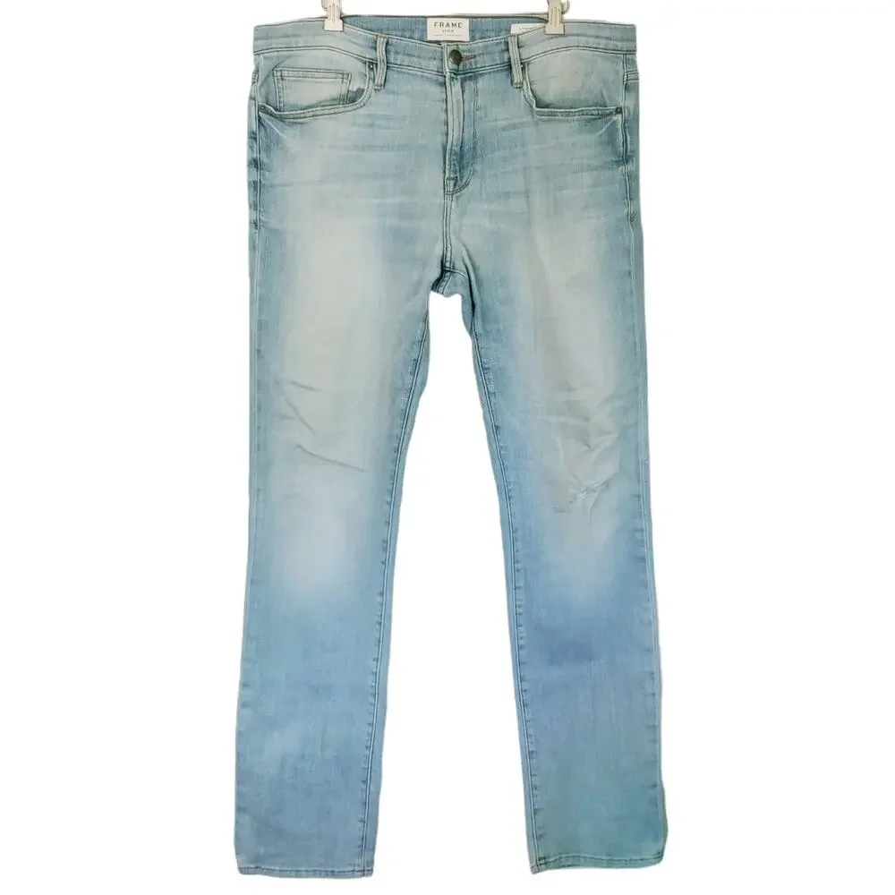 FRAME Denim L'Homme Slim fit distressed mid rise straight tapered jeans Finn 36